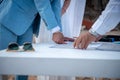 Newly wedded couple making wedding documents official by putting thumbprint