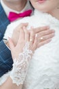 Newly wedded showing own hands with wedding rings