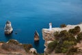 Newly-weds enjoy beautiful ocean view on cliff. Calm sea and water texture. Nature and festive event idea, copy space