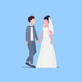 Newly weds man woman standing together romantic couple bride and groom holding hands wedding day celebration concept Royalty Free Stock Photo