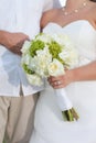 Newlywed couple with bouquet Royalty Free Stock Photo