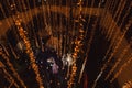 Newlywed couple dancing first dance from above, bride and groom waltz dancefloor lowlight Royalty Free Stock Photo