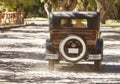 A newlywed couple is driving a convertible retro car Royalty Free Stock Photo