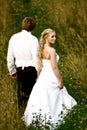 Newlywed couple in field