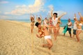 Newlywed couple have fun doing the limbo Royalty Free Stock Photo