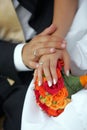 Newlywed couple holding hands