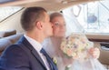 Newlywed Couple Kissing Each Other In car Royalty Free Stock Photo