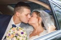 Newlywed Couple Kissing Each Other In car Royalty Free Stock Photo