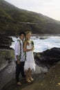 Newlywed couple on lava cliffs