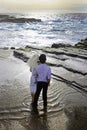 Newlywed couple on lava cliffs