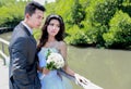 Newlywed couple standing at the wooden bridge Royalty Free Stock Photo