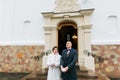 Newlywed pair releasing doves when leaving church after their wedding ceremony Royalty Free Stock Photo