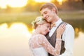 Newlywed young couple by lake Royalty Free Stock Photo