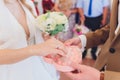 Newlyweds append signatures in a registry office during wedding registration.