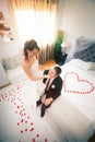 Newlyweds in bedroom with heart Royalty Free Stock Photo