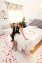 Newlyweds in bedroom with heart Royalty Free Stock Photo