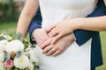 Newlyweds. Bride and groom hug each other. Hands with wedding rings close-up. Royalty Free Stock Photo