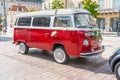 Newlyweds car. Red minibus volkswagen. Retro bus car. Decorated with bouquets of flowers. Festive decor, bridal bouquet