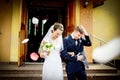 Newlyweds coming out of the church after wedding ceremony. Royalty Free Stock Photo