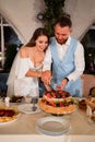 newlyweds cut off a traditional wedding cake. End of the holiday. Royalty Free Stock Photo