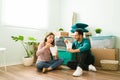 Newlyweds eating fast food in their new living room Royalty Free Stock Photo