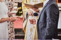 Newlyweds exchange rings during a wedding in a Catholic church