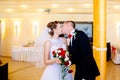 Newlyweds first kiss on wedding party. Royalty Free Stock Photo