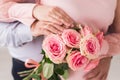 Newlyweds ` hands with rings. Wedding bouquet on the background of the hands of the bride and groom with a gold ring Royalty Free Stock Photo