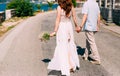 Newlyweds hold hands on the sea. Couple holding hands. Wedding i Royalty Free Stock Photo