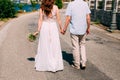 Newlyweds hold hands on the sea. Couple holding hands. Wedding i Royalty Free Stock Photo