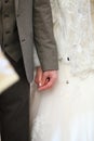Newlyweds holding hands during a wedding ceremony Royalty Free Stock Photo