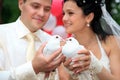 Newlyweds holding white doves Royalty Free Stock Photo