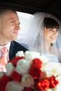 Newlyweds inside a car Royalty Free Stock Photo
