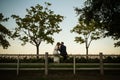 Newlyweds kiss at sunset