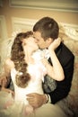 Newlyweds kiss in wedding palace
