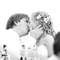 Newlyweds kissing