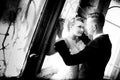 Newlyweds kissing near old door