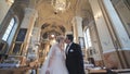 The newlyweds leave the church after their wedding in the Catholic Church. Royalty Free Stock Photo