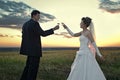 Newlyweds making a toast at dawn Royalty Free Stock Photo