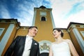 Newlyweds posing in front of Lukavec castle