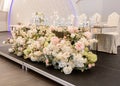 Newlyweds presidium mirror table decorated with flowers and candles