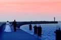 Newlyweds sea sunset walk