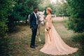 Newlyweds are standing near a white horse in nature Royalty Free Stock Photo