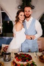 newlyweds with a traditional wedding cake. End of the holiday. Royalty Free Stock Photo