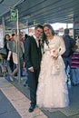 Newlyweds in Venice at the water bus stop