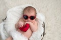 Newobrn Baby Girl with Heart Shaped Sunglasses Royalty Free Stock Photo