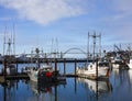 Newport bay bridge and docked fishing boats.