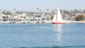 Newport beach harbor, weekend marina resort with yachts and sailboats, Pacific Coast, California, USA. Waterfront luxury suburb