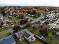 The aerial view of the residential neighborhood surrounded by stunning colors of fall foliage near Newport, Delaware, U.S