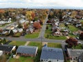 The aerial view of the residential neighborhood surrounded by stunning colors of fall foliage near Newport, Delaware, U.S